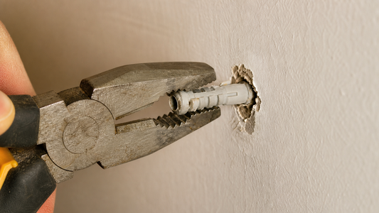 Removing a drywall anchor without damaging the wall