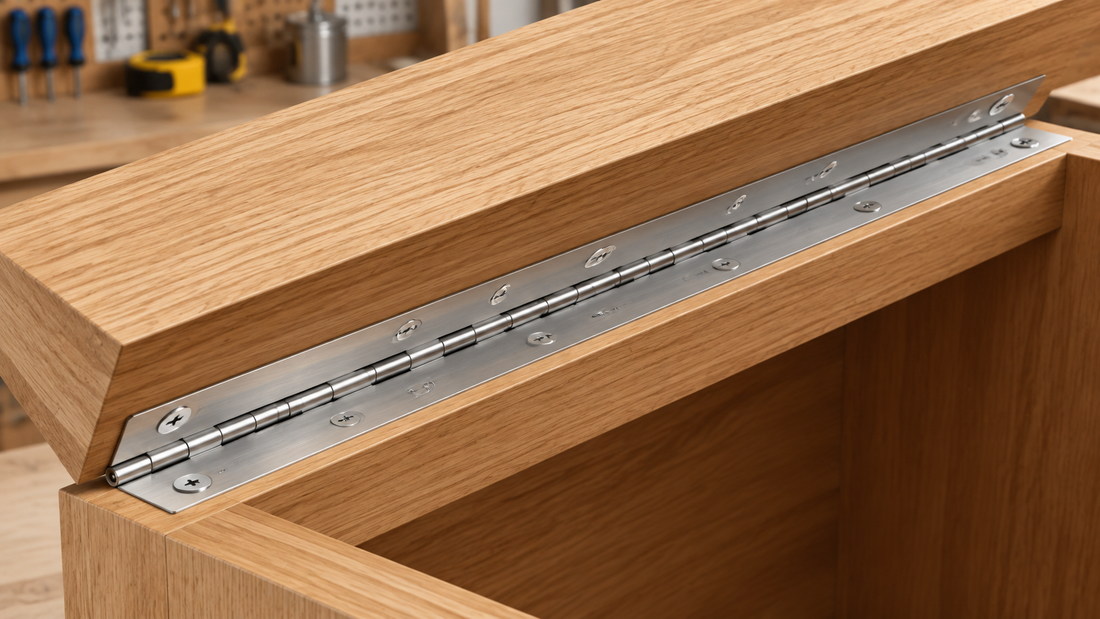 Straight silver piano hinge installed on a wooden cabinet lid